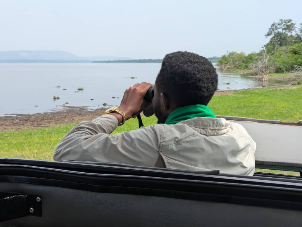 guide take photo of lake